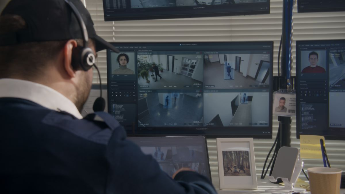 Security,Officer,In,Headset,Monitors,Cctv,Cameras,On,Computer,In