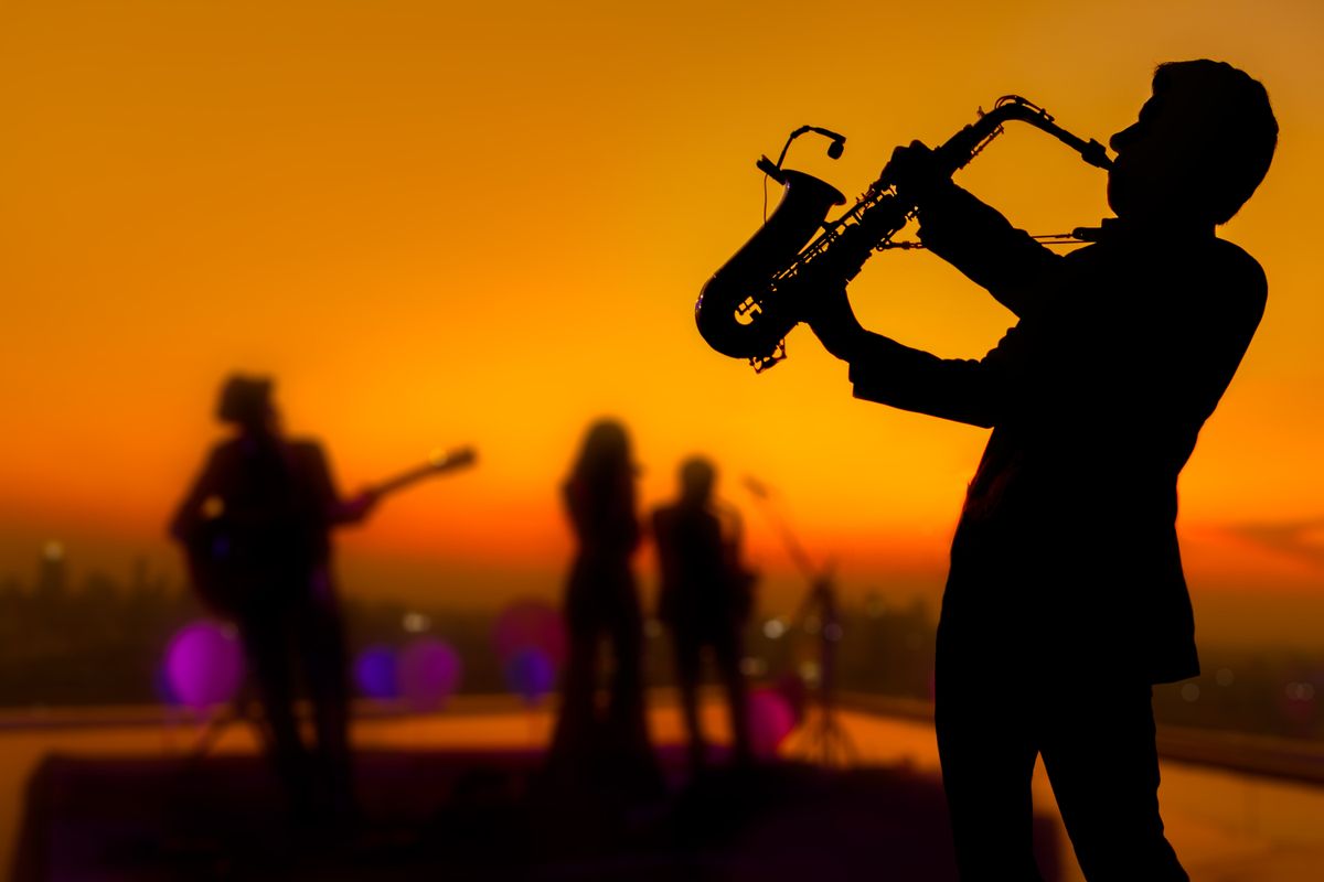 Silhouette,Saxophone,Musician,Man,Showing,On,Blurry,Jazz,Trio,Band program
