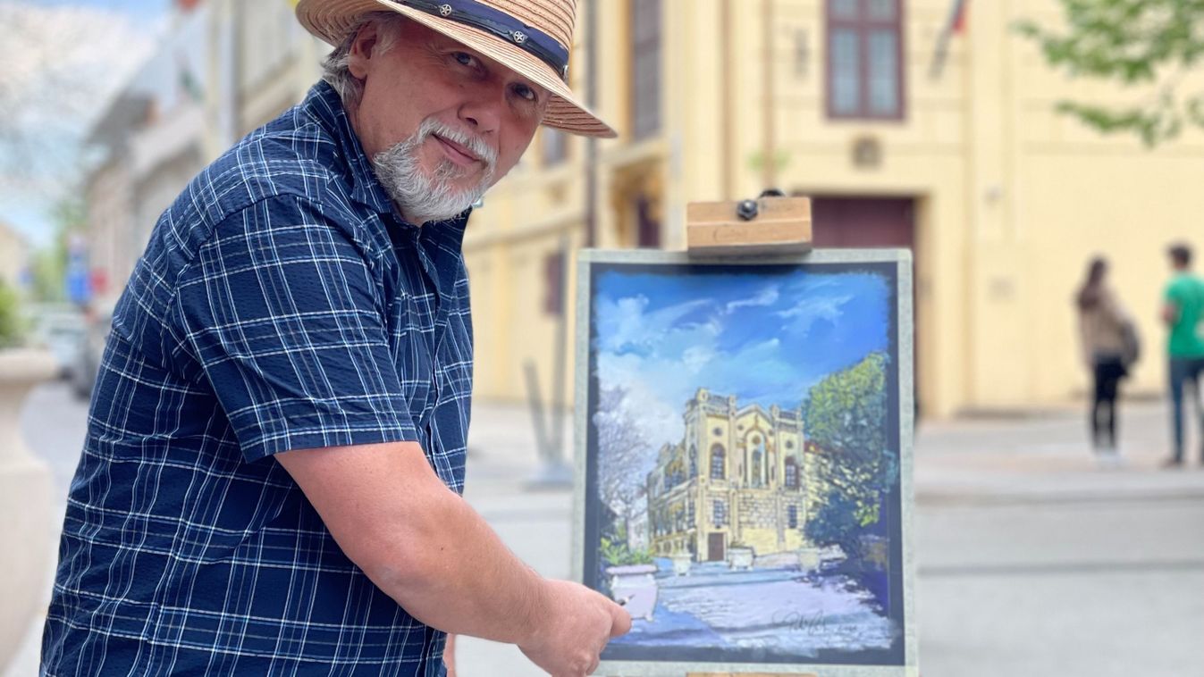 Festőállvánnyal a hóna alatt jár utcáról utcára, örömmel festi képre festi a...